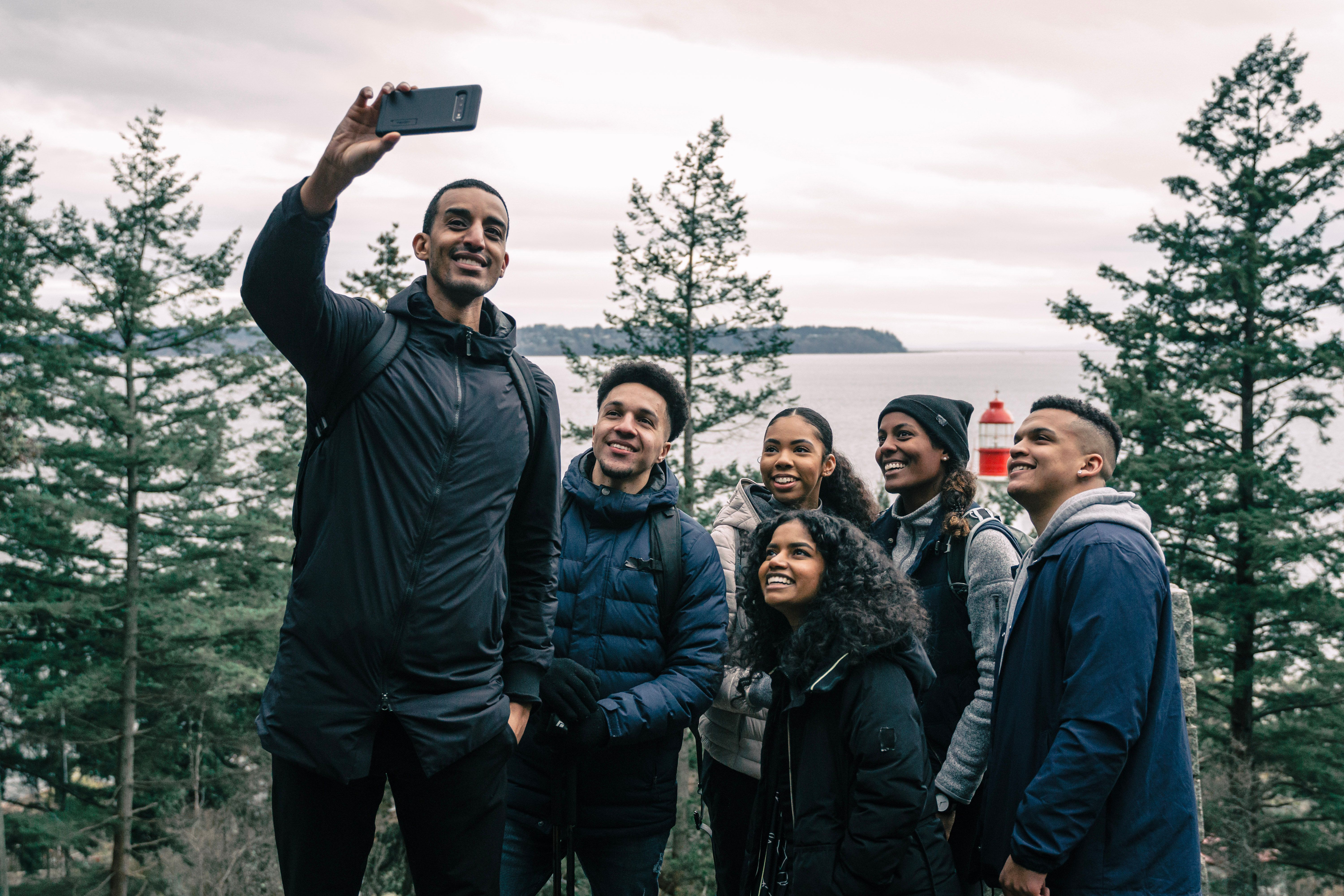 Friends taking a group selfie during a hiking trip